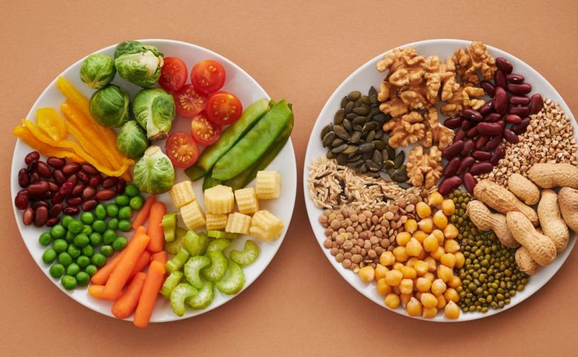 A vibrant flatlay of colorful vegetables and nuts showcasing a balanced diet concept.